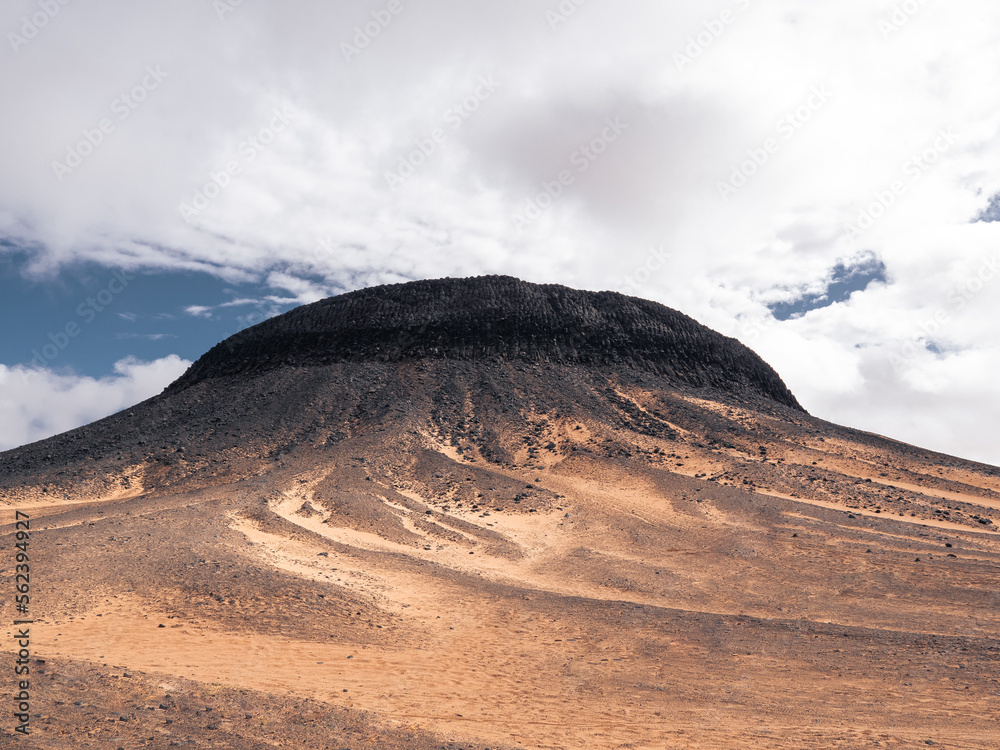 A volcanic hill in the Black Desert, Egypt.