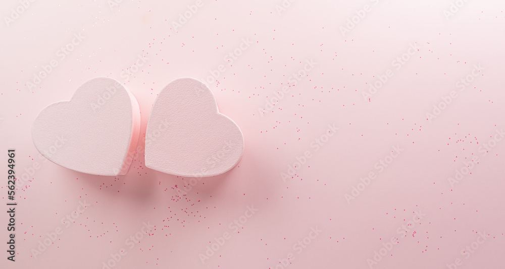 Happy valentine's day and love decoration background concept made from two hearts on pastel pink background.