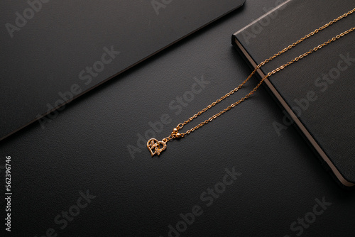 Gold jewellery necklace on black background