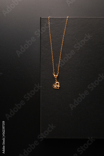 Gold jewellery necklace on black background
