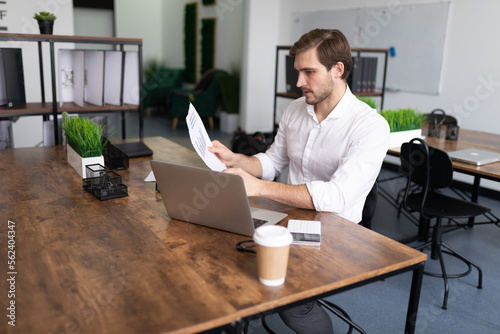 male businessman working with documents laptop in the office