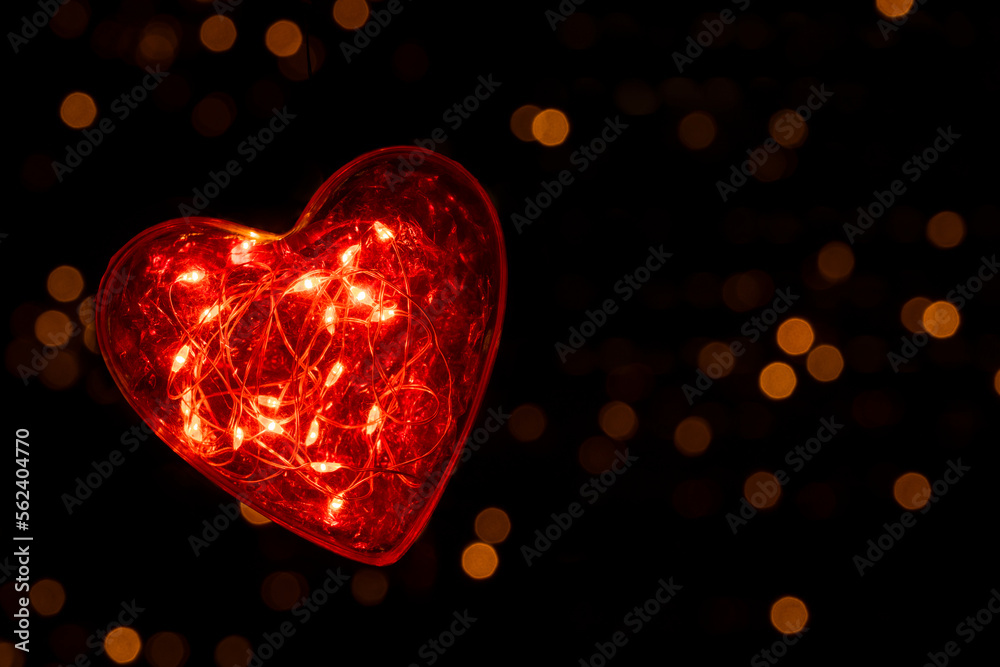 illuminated heart with light bokeh background illuminated heart with light bokeh background