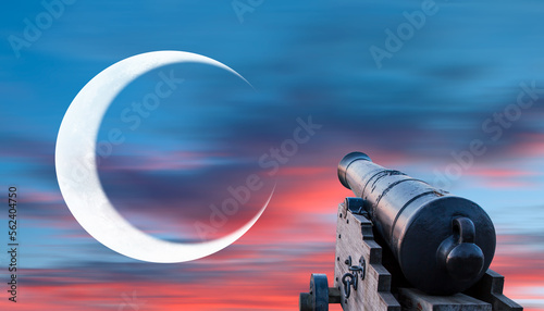 Fotografia Ramadan Concept - Ramadan kareem cannon with crescent - Night sky with moon in t