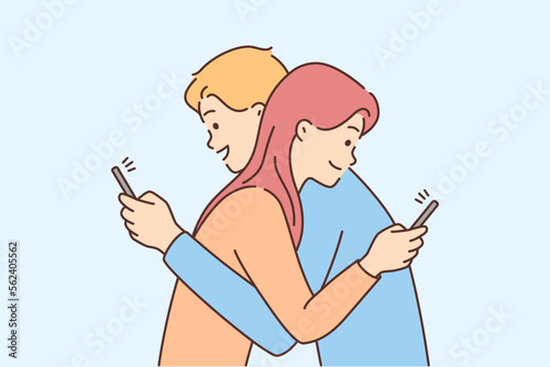 Couple hug using cellphone 