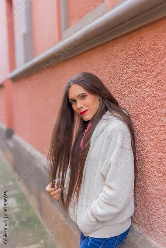 Portrait of transgender woman walking through city © jorge