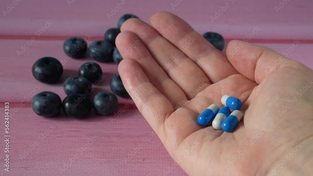 many fresh natural fruits vs pills. Natural vitamin in fruits vs synthetic vitamin in pills. Choice between natural and synthetic way of health care. Alternative medicine. many fresh natural fruits vs pills. Natural vitamin in fruits vs synthetic vitamin in pills. Choice between natural and synthetic way of health care. Alternative medicine.