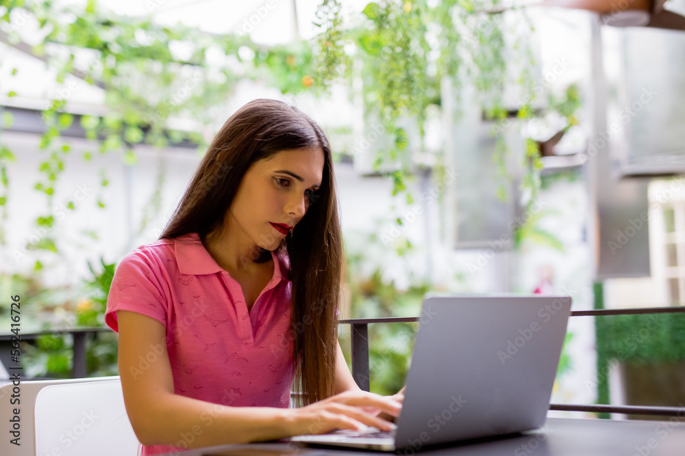 Transgender woman working with her laptop, social integration concept Transgender woman working with her laptop, social integration concept