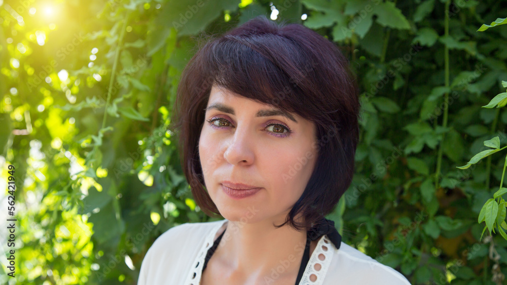 Brunette face with brown eyes and short hair., Brunette face with brown eyes and short hair.,