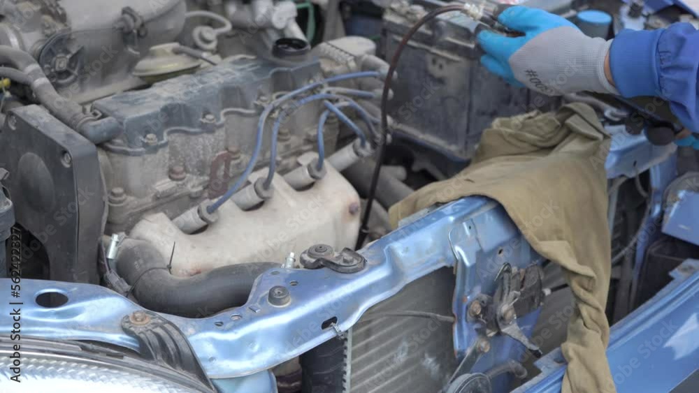 pump oil from the engine of the car,the mechanic changes the old oil in