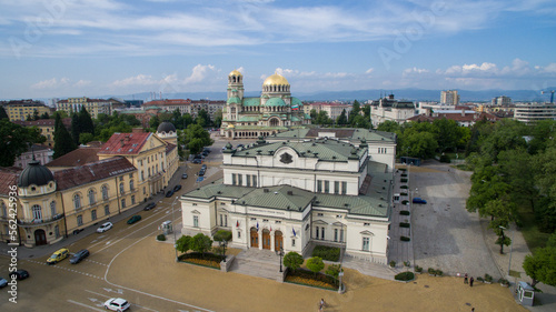 Drone photo of the building of the Bulgarian Parliament with St. Alexander Nevsky Cathedral behind it in Sofia, Bulgaria