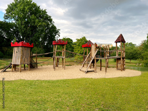 Beautiful wooden children's playground on sand outdoors