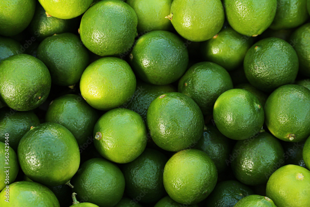 Fresh ripe green limes as background, top view Fresh ripe green limes as background, top view