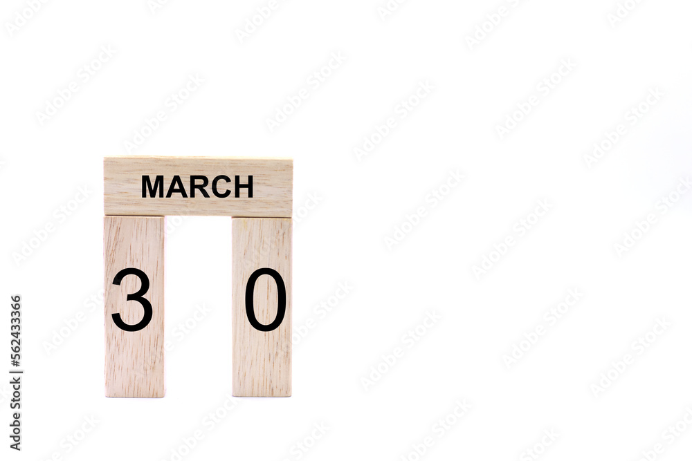 March 30 displayed wooden letter blocks on white background with space for print. Concept for calendar, reminder, date. March 30 displayed wooden letter blocks on white background with space for print. Concept for calendar, reminder, date.