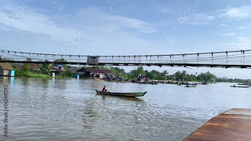 A traditional floating market selling produce  fruit and vegetables on the Martapura River and canals in Banjarmasin  South Kalimantan photo