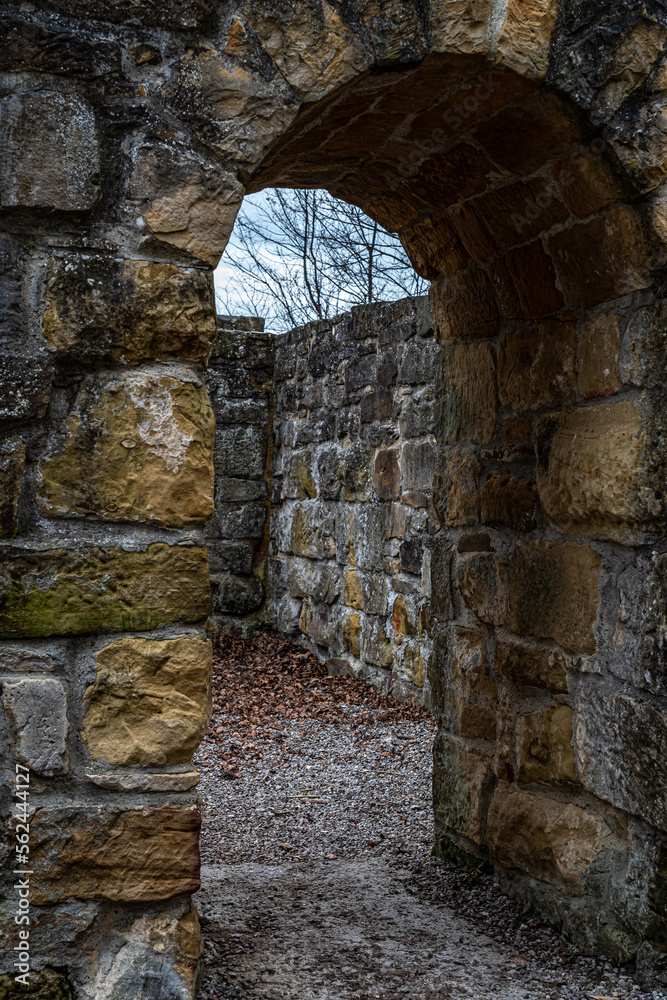 Big walls of an old castle ruin with entrance inside