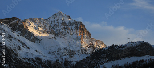 Sun lit peak of Mount Arpelistock, Switzerland. photo