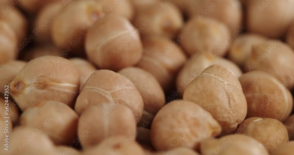 Raw chickpeas, rotation. Chickpeas, close-up dolly shot. Macro footage of chickpeas beans. Food cooking video. Raw chickpeas, rotation. Chickpeas, close-up dolly shot. Macro footage of chickpeas beans. Food cooking video.