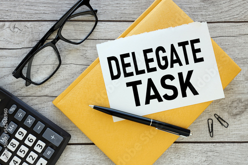 Photography delegate tasks yellow notepad