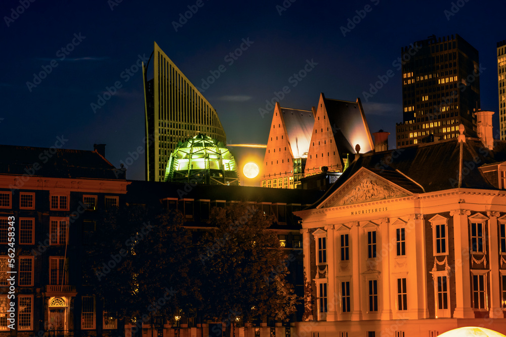 Full Moon behind the Dutch Parliament and skyline at night in The Hague, Netherlands