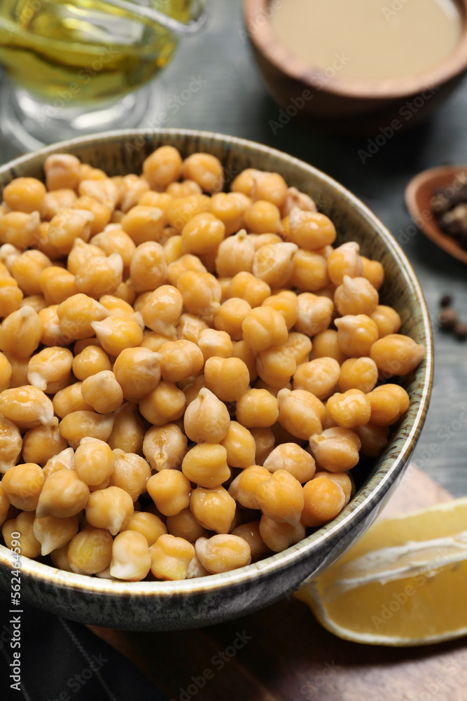 Delicious hummus on light blue wooden table, above view Delicious hummus on light blue wooden table, above view
