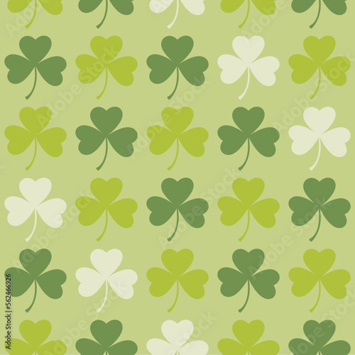 Saint Patrick's Day greetings with tree leaf clovers on green background.