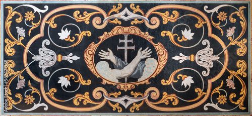 LUZERN, SWITZERLAND - JUNY 24, 2022: The stone baroque mosaic (pietra dura) of a cross, Christ's arm and Saint Francis's arm, a symbol of the Franciscans in church Franziskanerkirche.