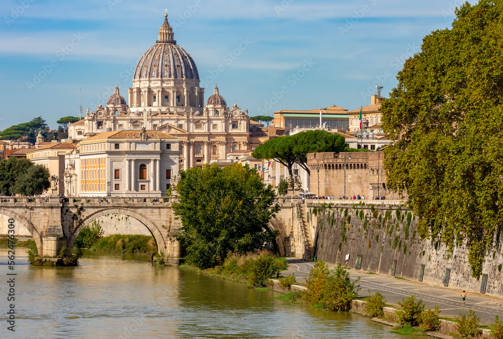 St Peter's basilica in Vatican and St. Angel bridge over Tiber river in Rome, Italy