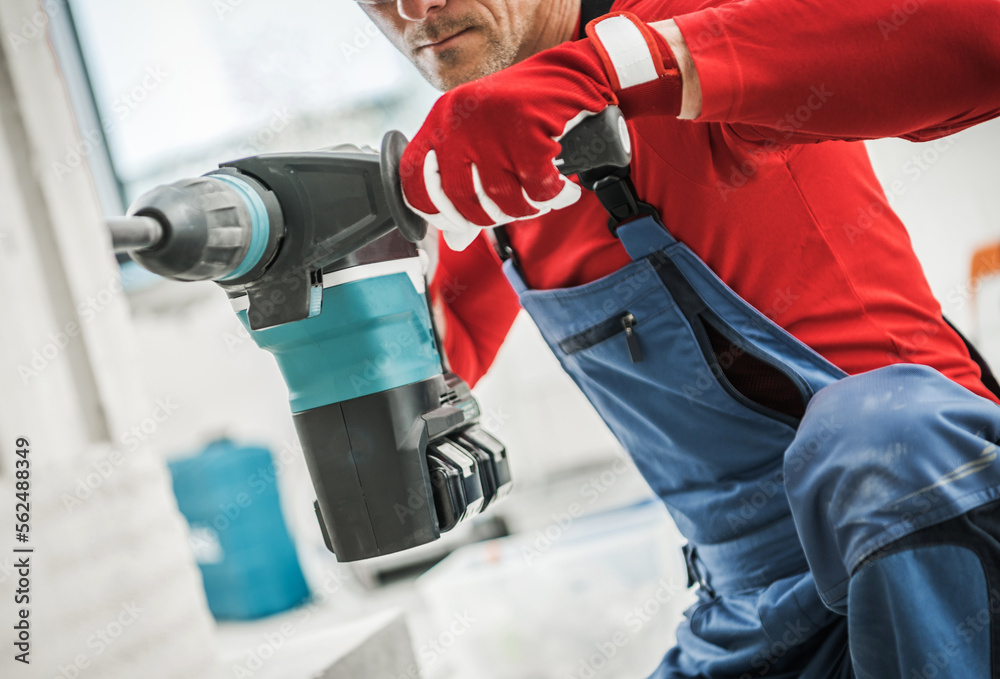 Fototapeta premium Concrete Hole Drilling by Construction Worker