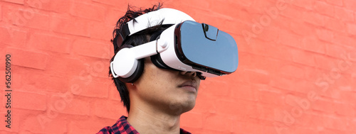 Foto Horizontal banner or header with portrait of bored young asian man using 3d view