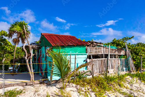 Tropical natural beach palm tree hut Playa del Carmen Mexico. © arkadijschell