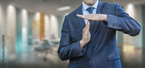 Obraz na płótnie Businessman with hand gestures shows stop doing work .