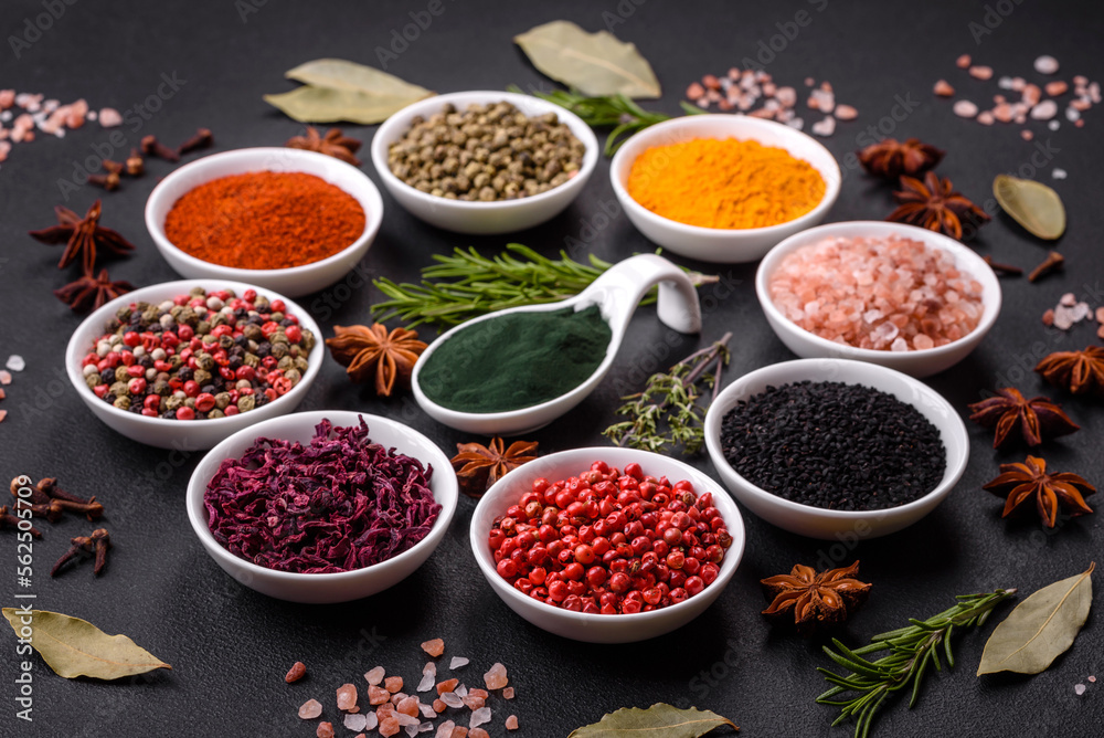 Composition consisting of a variation of several types of spices in white bowls