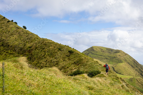 Person going up an old crater rim on São Jorge island in the Azores 