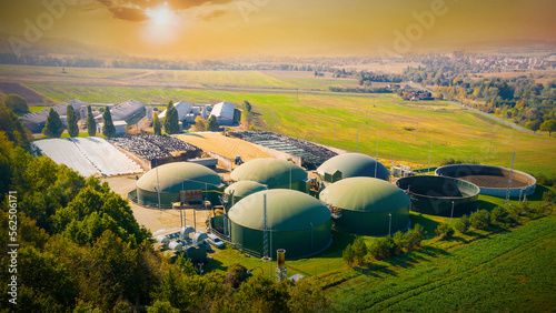 Biogas plant and farm in fields. Renewable energy from biomass. Agriculture prepared for Green Deal. Aerial view to Czech industry. Sustainable development in European Union.