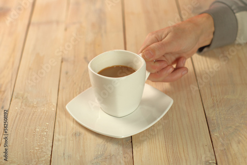 person holding a cup with coffee