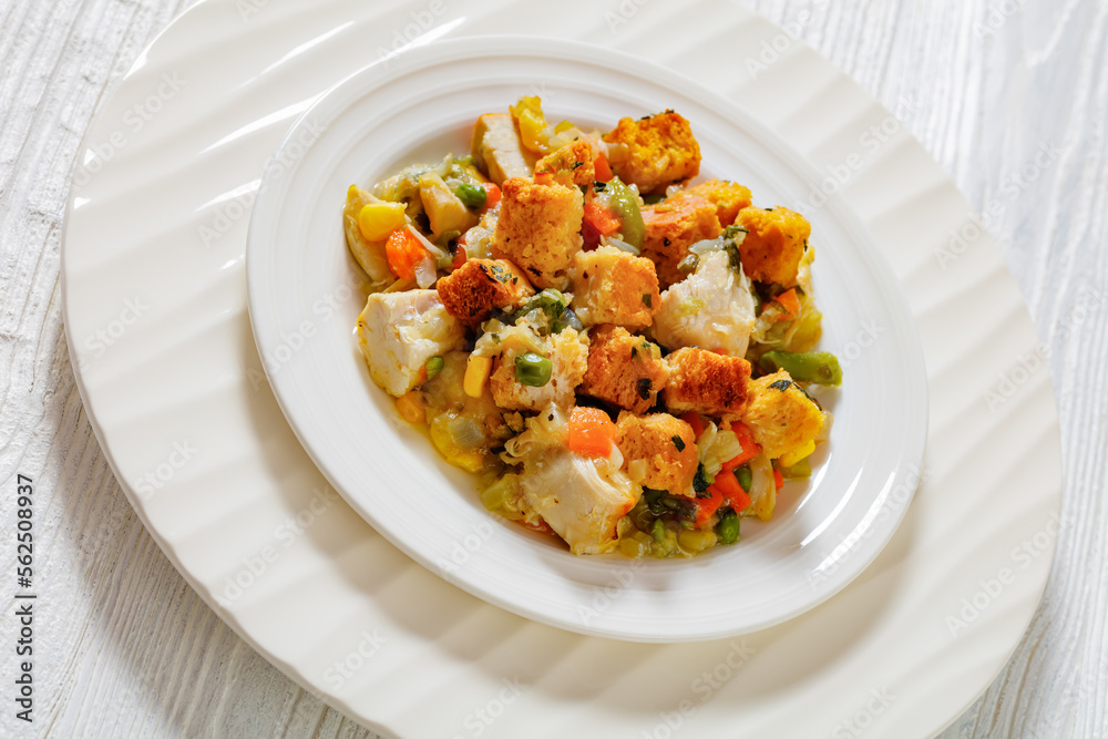 turkey pot pie with stuffing crust on plate turkey pot pie with stuffing crust on plate
