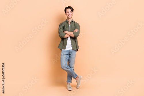 Full body length photo cadre of youngster student folded arms looking interested mockup opening new restaurant isolated on beige color background