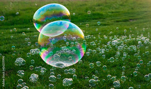Soap bubbles on the grass. Selective focus. Blurred background.