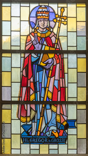 TASCH, SWITZERLAND - JULY 2, 2022: The stained glass with the St. Gregory the Great in the parish church designed by August Wanner and made by Wilhelm Klotz from 20. cent. photo
