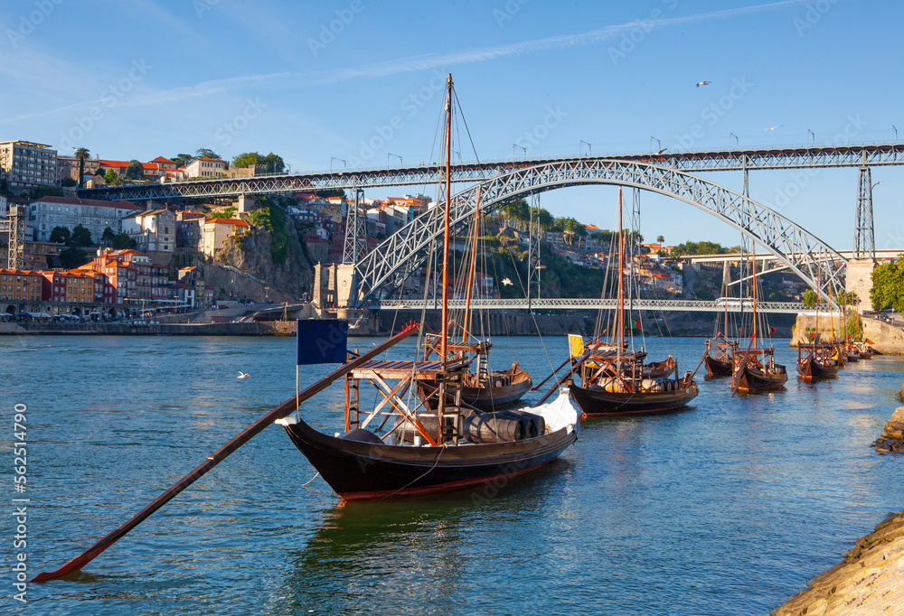 Traditional Rabelos on the River Douro with Dom Luis 1 Iron bridge in background Traditional Rabelos on the River Douro with Dom Luis 1 Iron bridge in background