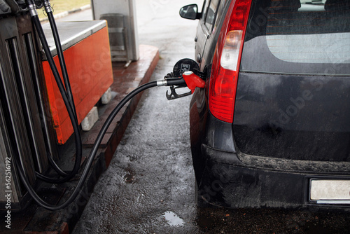 Refueling a car at a gas station close-up