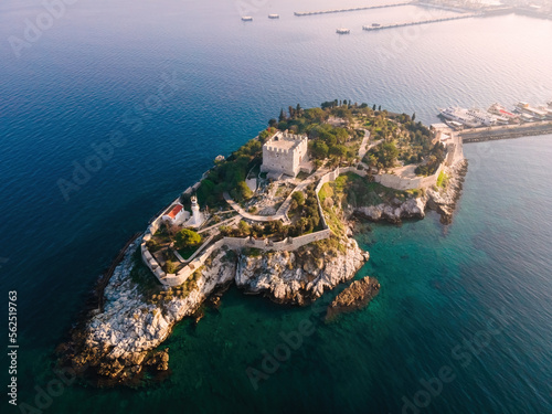 Fototapeta Naklejka Na Ścianę i Meble -  Aerial wide shot of castle tower of Pigeon Island - Guvercinada in Kusadasi Turkey in sunrise time