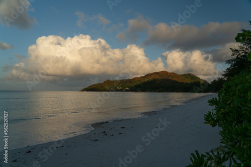 View along the long beach of Anse Volbert in the evening. photo