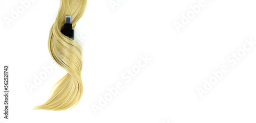 Different professional hairdresser tools hair spray and strand of blonde hair on white background, flat lay. Hair care spa concept.