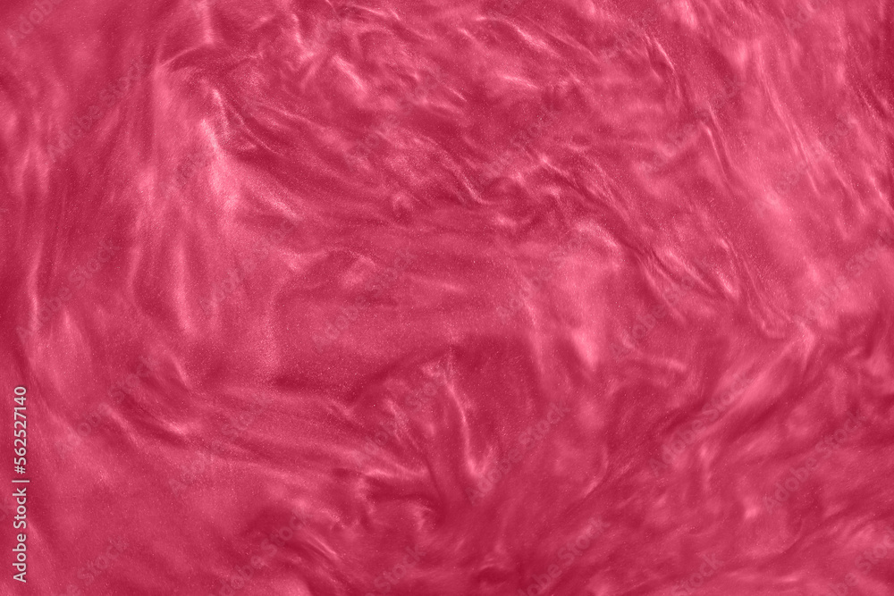 Abstract pink-red liquid paint gradient background toned into Viva Magenta color. Inspired by new Pantone color of the year 2023. Glittering nail polish red maroon textured pattern.