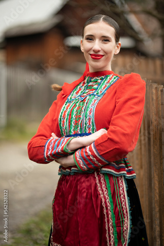 Young beautiful slovak woman in traditional dress. Slovak folklore