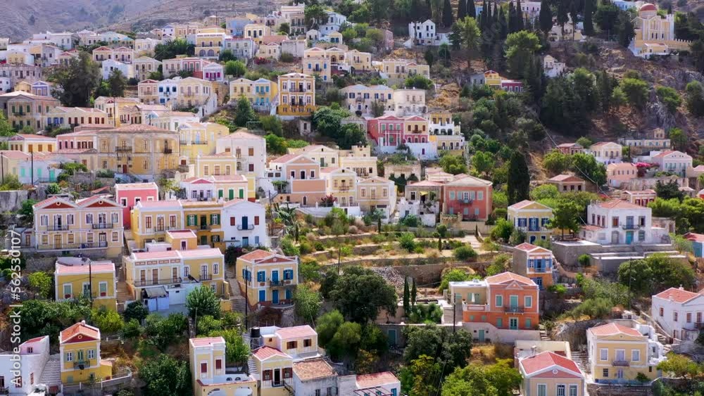 View on Symi (Simi) island harbor port, classical ship yachts, houses on island hills, Aegean Sea bay. Greece islands holidays vacation travel tours from Rhodos island. Symi, Greece, Dodecanese. View on Symi (Simi) island harbor port, classical ship yachts, houses on island hills, Aegean Sea bay. Greece islands holidays vacation travel tours from Rhodos island. Symi, Greece, Dodecanese.
