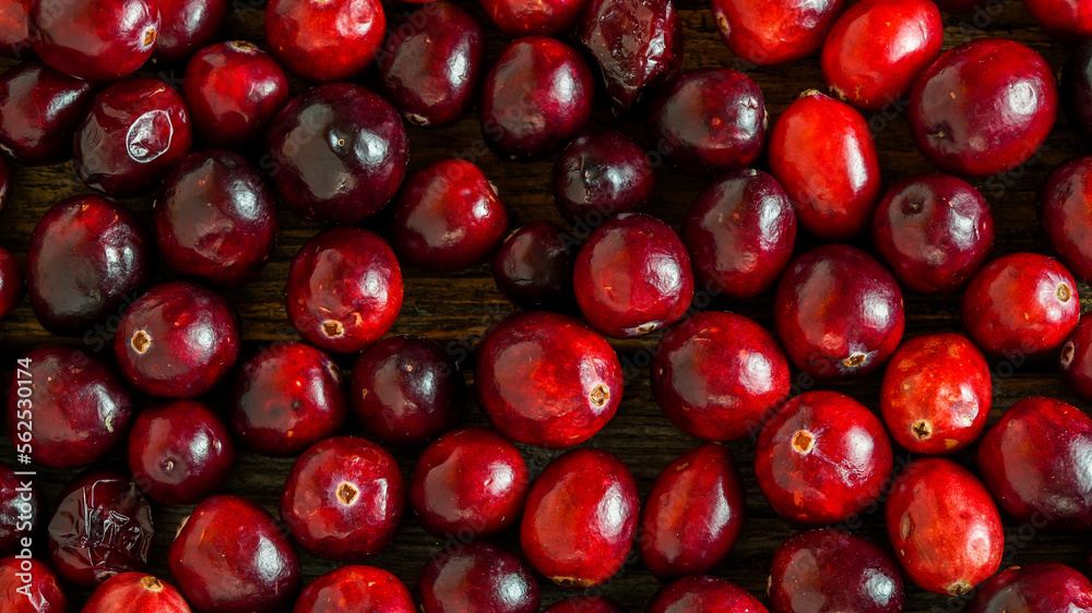Cranberry background on rustic wooden background Cranberry background on rustic wooden background