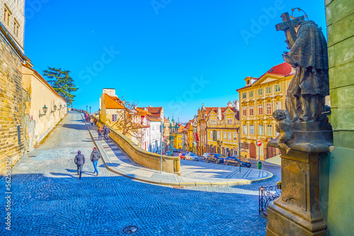 The sculpture of the Jan Nepomuck on the corner at Ke Hradu descent leading to Prague Castle, Czechia photo