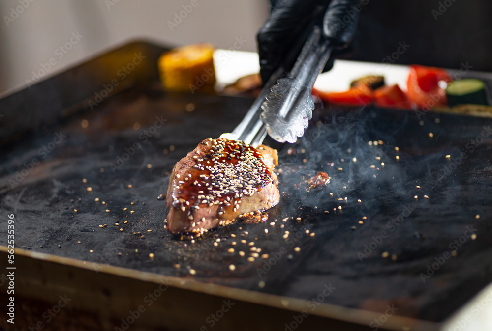 Ταπετσαρία A piece of meat with spices cooked on a hot griddle